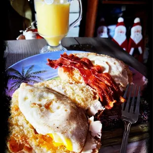 Fried egg with bacon sandwich on ciabatta bread.