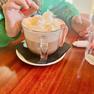 a woman eating a cup of coffee