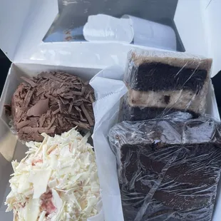 From top left: Chocolate Cupcake, German Chocolate Cake, Truffle Cake, White Bavarian Raspberry Cupcake.