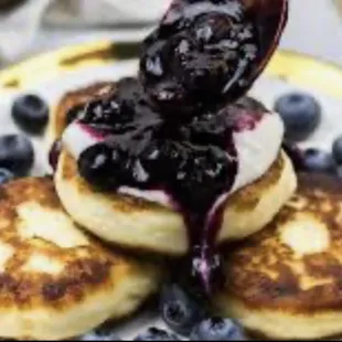 Syrniki - tvorog pancakes 
Enjoy with blueberry jam, honey 
Made fresh everyday