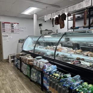 a deli counter with a variety of foods