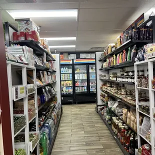 a grocery store aisle with a variety of products