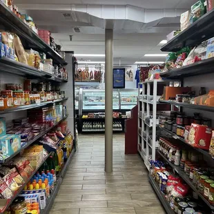 a grocery store aisle with shelves full of food