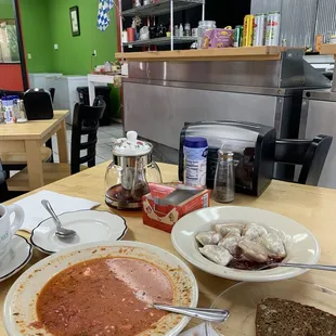 Borcht (red beet soup), cherry filled pierogi, and tea