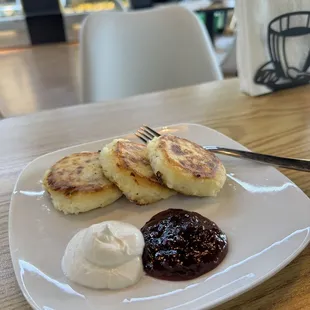 Syrniki- little pancakes made with a cottage cheese and served with sour cream and jam