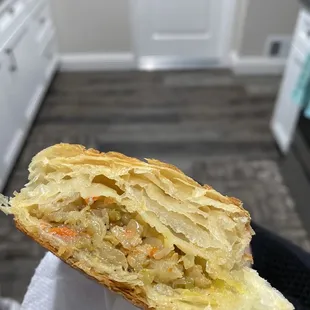 a person holding a pastry