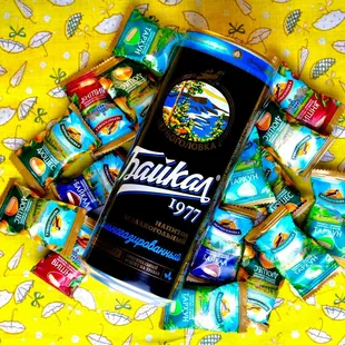 a can of beer surrounded by candy
