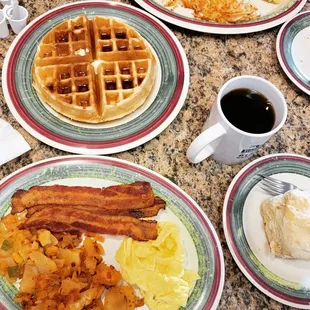 Belgian waffle, biscuit, bacon, eggs, hash brown, white toast and coffee