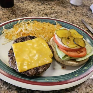 Cheeseburger  and hash browns.