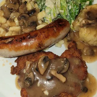 German food made with ingredients from Eurozone Pork Schnitzel  Bratwurst  Bread Dumplings Spaetzel with mushroom   gravy