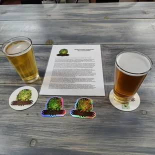 a pint of beer and coasters