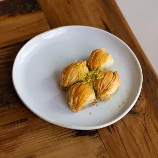 a plate of pastries on a wooden table