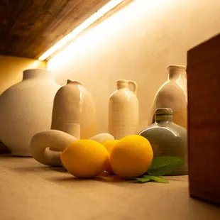 a variety of vases and oranges