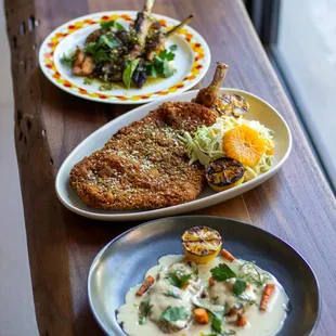 two plates of food on a wooden table