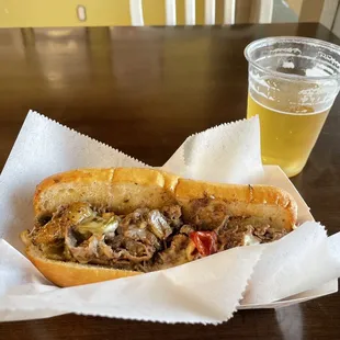 Mushroom cheesesteak with sweet peppers and a Backstreet Mex Lager