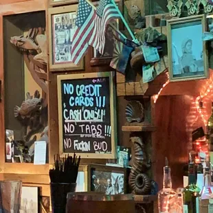a bar with a sign saying no credit