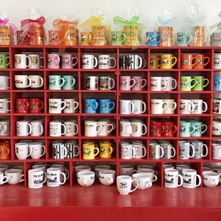 Colorful display of Cafe du Monde souvenir coffee cups