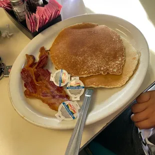 a plate of pancakes and bacon