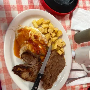 Huevos rancheros with pork chop