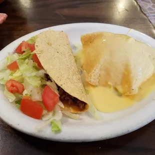 #4 lunch special: crispy taco, cheese puff, beef enchilada with rice and beans