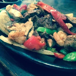 Fajitas for One: chicken, beef, and shrimp for $11.95! Great deal.