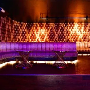 a purple couch in a dimly lit room