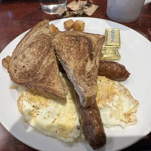 Two overcooked eggs, 1 piece of toast, not plated with aesthetics in mind.