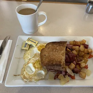 Child sized  hash breakfast with coffee - $20 after tax. How? 1 piece of toast, 2 overcooked eggs, and unremarkable hash.