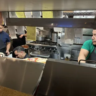 Cooks working assembly line.
