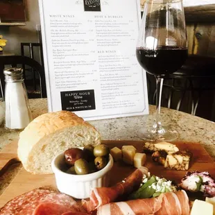 an assortment of meats and cheeses