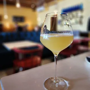 a glass of wine on a table