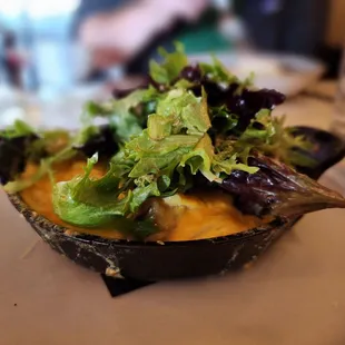 a bowl of salad on a plate