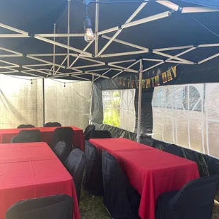 10x 10 party tent with tea lights. Rectangle tables, chairs and seat covers.
