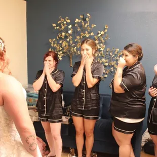 Bride first look with the bridal party in the gals ready room!