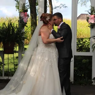 Bride and groom first kiss at altar