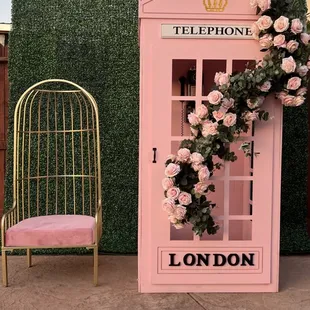 Our pink photo booth  on display paired with our cage chair