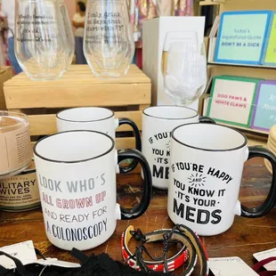 Just a few of the many funny mugs and wine glasses