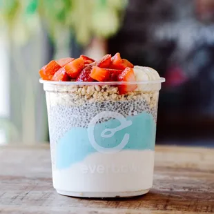 a yogurt with strawberries and chia seeds