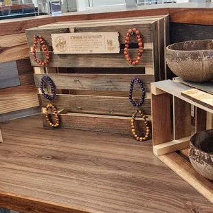 Repurposed coconut shells (bowls), colorful acai seed bracelets and a banana cutter.