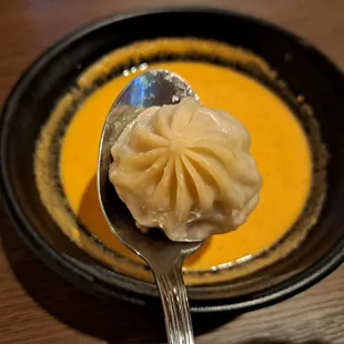 steamed lamb momo served with jhol