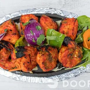 a platter of grilled chicken