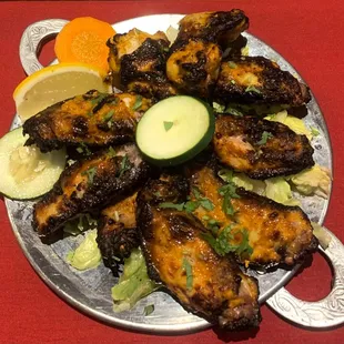 Everest Wings - Marinated in a secret blend known only to our tandoori chef then grilled in tandoor to produce a one of a kind wing dish