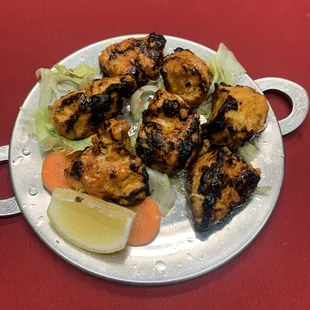 Chicken Tikka - Tender bonless cubes of chicken seasoned in a rich blend of yogurt, lemon juice and spices, and grilled tandoori style.