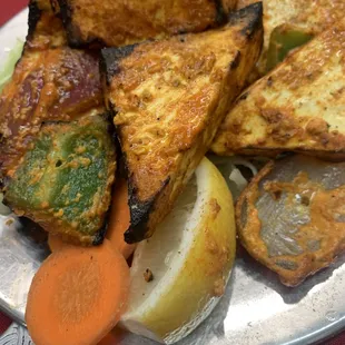Tandoori Paneer - Indian styled cottage cheese marinated in a spicy tandoori masala then grilled to perfection.