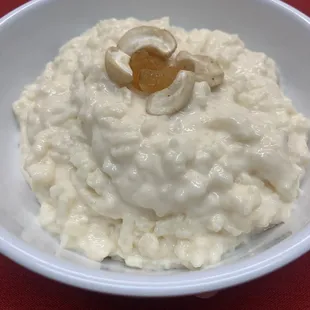 Kheer - Rice pudding with slivers of almonds topped  with golden raisins and cashews.