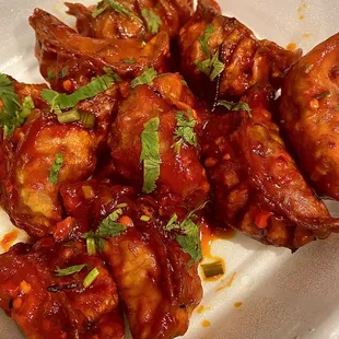 a plate of chicken wings