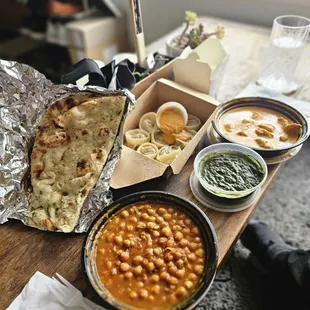 Chana Masala, Goat Momo, Spinach Dip with Garlic Naan, Chicken Tikka Masala