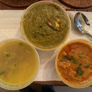 Trio of daal, spinach paneer, and vegetable curry.