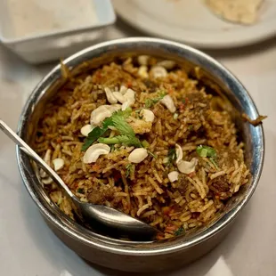 Goat Biryani, flavorful and moist with sauce, very good