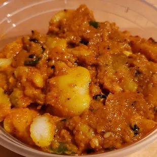 Potato achaar ($5). Vegan by default and decent, but not amazing. Slightly salty &amp; vinegar-y.